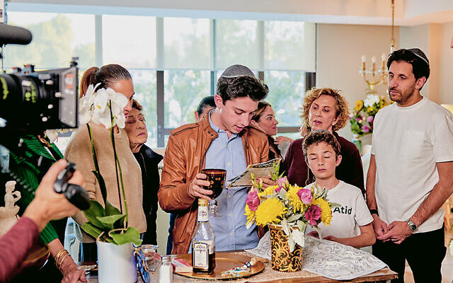Eitan Bernath recites Kiddush as he models a traditional Shabbat lunch on Friday with local Jewish chef Estrella Jafif and her extended family. (All photos Eitan Productions/Tastemade)