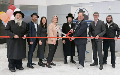 From left: Rabbi Mordechai Kanelsky, Rabbi Avremy Kanelsky, Chaya Kanelsky, Sarah McKeon, Rabbi Meyer Rottenberg, Frank Radics, Stefan Fornasier, and Martin Fischman. (Courtesy Bris Avrohom)