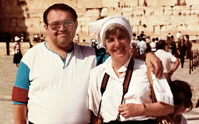 Bruno and Tzivia are at the Kotel in 1987; their youngest daughter, Dena, peeps out from behind her mother.