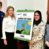 From left: Joseph Sprung, chairman and founder of Bear Givers, and Michele Mirman, its president, are with Sinai art therapists Sarah Tarzik and Esther Savetsky at the art show.