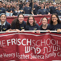 Frisch Students from the Frisch School in Paramus walk behind their banner. Frisch Students from the Frisch School in Paramus walk behind their banner.