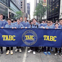 Students from the Torah Academy of Bergen County in Teaneck stand behind their banner. Students from the Torah Academy of Bergen County in Teaneck stand behind their banner.