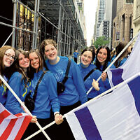 Students from the Ma’ayanot Yeshiva High School for Girls in Teaneck hold both Israeli and American flags. Students from the Ma’ayanot Yeshiva High School for Girls in Teaneck hold both Israeli and American flags.