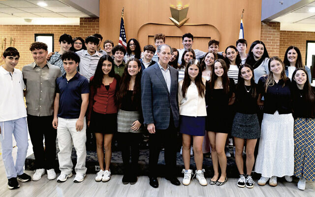 Allan Chernoff is surrounded by 10th graders for the Golda Och Academy’s Names Not Numbers program. (GOA) Allan Chernoff is surrounded by 10th graders for the Golda Och Academy’s Names Not Numbers program. (GOA)