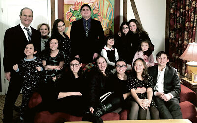 Ms. Fein’s parents with 13 of their 14 grandchildren.