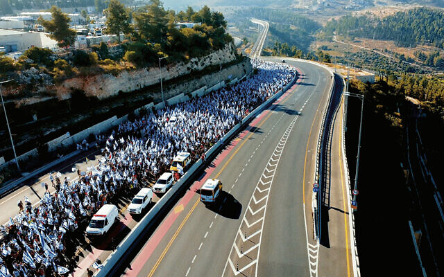 Protesters march on a highway in Israel, in a still from “Soul of a Nation.” (Greenwich Entertainment)