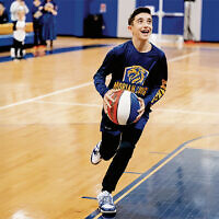 A student plays at the pep rally.
