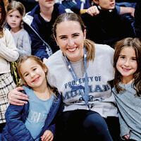 The Lazaros family watches the game together.