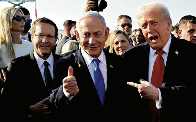 U.S. President Donald Trump poses with Israeli President Isaac Herzog and Israeli Prime Minister Benjamin Netanyahu at Ben Gurion Airport on Oct. 13. (Chip Somodevilla/Getty Images)