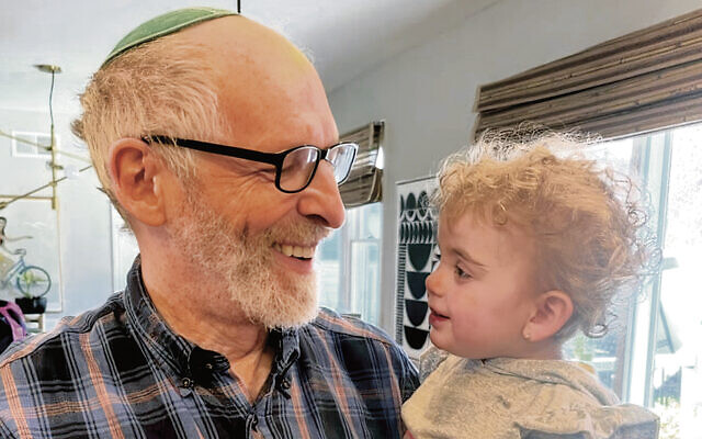 Rabbi Diamond with his granddaughter Elle. Rabbi Diamond with his granddaughter Elle.
