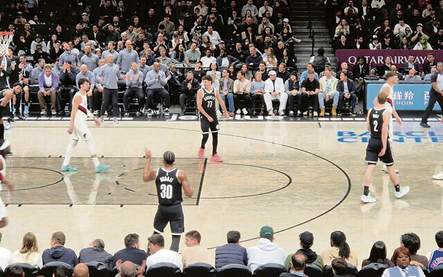 Ben Saraf, Deni Avdija and Danny Wolf share the court during the Portland Trail Blazers-Brooklyn Nets matchup on March 16. It was the first NBA game to feature three players with Israeli citizenship. (Grace Yagel)