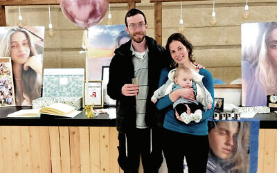 Gil Amminadav and Natania Casden with their baby, Gefen Amit, at the Amit meetup in Netivot on February 18.