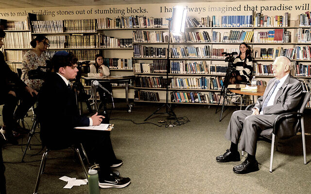 Students film an interview with survivor Norbert Strauss in the library at Golda Och Academy. (All photos courtesy Golda Och Academy) Students film an interview with survivor Norbert Strauss in the library at Golda Och Academy. (All photos courtesy Golda Och Academy)