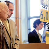 Honoree Israel Raikher and his son, Michael, listen as Sam Heidenberg tells Mr. Raikher’s story.