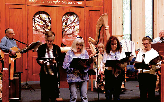 At B’nai Israel, from left: Guitarist George Ginsberg, Linda Shapiro, Carolyn Ginsberg, harpist Judy Schoenfeld, Naomi Weinberg, Robin Ingram, and recorder player Bernard Schoenfeld. (Bruce Weinberg) At B’nai Israel, from left: Guitarist George Ginsberg, Linda Shapiro, Carolyn Ginsberg, harpist Judy Schoenfeld, Naomi Weinberg, Robin Ingram, and recorder player Bernard Schoenfeld. (Bruce Weinberg)