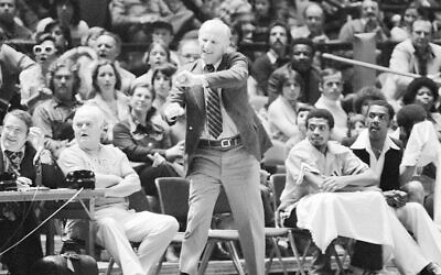 Knicks coach Red Holzman is on the sidelines during game action against the Philadelphia 76ers on March 5, 1977. (Getty Images)