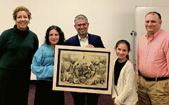 From left, Keisha Carter, Ella, Yigal, and Sara Gross, and Benjamin Burnat. Ms. Carter and Mr. Burnat are vice president and president, respectively, of the Teaneck library’s board of trustees. Mr. Gross holds the Nast drawing.