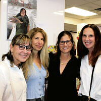 Lauri Bader of Englewood, Gayle Grossman-Alweiss of Closter, Barbara Brensilber of Tenafly, and Eileen Stauber of Fort Lee tour the exhibit.