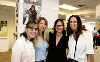 Lauri Bader of Englewood, Gayle Grossman-Alweiss of Closter, Barbara Brensilber of Tenafly, and Eileen Stauber of Fort Lee tour the exhibit.