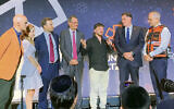 From left: United Hatzalah chairman Mark Gerson; his wife, Rabbi Erica Gerson; UH board member Alex Witkoff; investor and sports team owner David Blitzer; former hostage Bar Kupershtein; Israeli Ambassador Ron Dermer, and United Hatzalah founder and president Eli Beer. (Courtesy United Hatzalah)