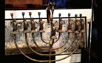 The Statue of Liberty Hanukkah Lamp by Manfred Anson was on display at the Statue of Liberty Museum in 2019. (Timothy A. Clary/AFP)