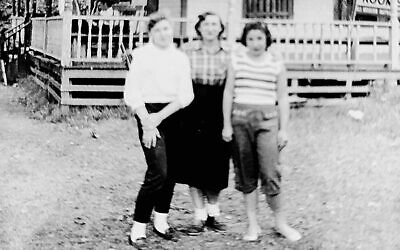 On closing day in 1956, Rosanne’s sister, Janet Goren, left, their mother, Ida Litwak, and Rosanne Skopp stand by Bauman House. Its windows are boarded up for the winter.