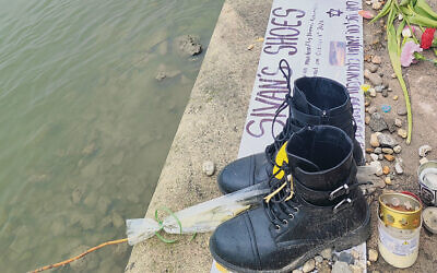 These are the shoes of Sivan Shahrabani, murdered by Hamas at the Nova music festival on October 7; they’ve been added to the Shoes on the Danube memorial.