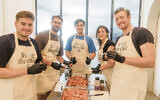Volunteers prepare meals for the needy.