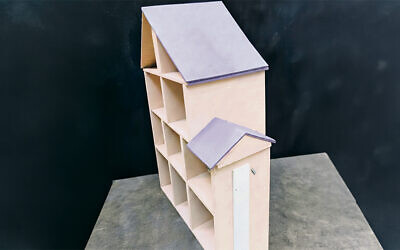 This is one of the purple-roofed dollhouses Mr. Skopp built.