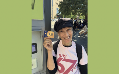 Abby wears her 67 shirt and holds her new Zahav-Kav, entitling her to free public transportation.