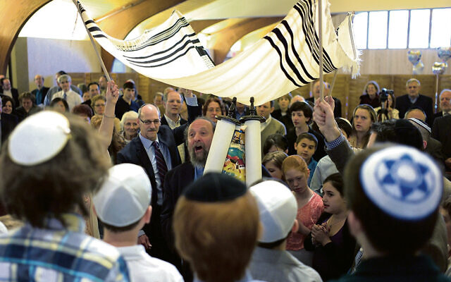 Lenny Mandel dances with an illuminated Torah as a chuppah is held overhead.(Llenny Mandel) Lenny Mandel dances with an illuminated Torah as a chuppah is held overhead.(Llenny Mandel)