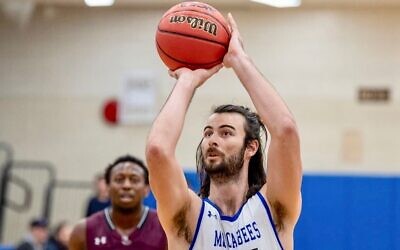 Jordan Armstrong, a 6′-8″ forward for Yeshiva University’s men’s basketball team, pulled down seven rebounds and had two blocks in the Maccabees’ 93-86 win over New Jersey City University, Dec. 15, 2021. (Joe Bednarsh/Y.U. Athletics)