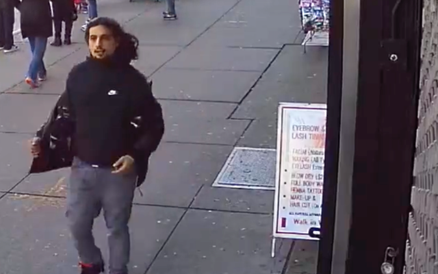 The NYPD Hate Crimes unit released footage of an alleged assailant who taunted and struck a Jewish man in Bay Ridge on Sunday, Dec. 26, 2021. The victim was wearing a sweatshirt with the logo of the Israeli army. (NYPD via Twitter)