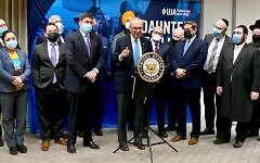 Sen. Charles Schumer (D-NY), center, flanked by area religious leaders at the Manhattan headquarters of UJA-Federation of New York, called on Congress to approve $360 million for the Nonprofit Security Grant Program, Jan. 26, 2022. UJA CEO Eric S. Goldstein, front row, third from left, said that “security enhancements put in place with these funds can and will save lives.” (Courtesy UJA-Federation)