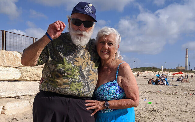 Former New Yorkers Joel Tenenbaum, 81, and Marilyn Berkowitz, 84, enjoy the beach just north of Tel Aviv. They joined a record wave of U.S. retirees who relocated to Israel in 2021, according to immigration assistance organization Nefesh B’Nefesh. (Courtesy)