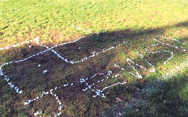 A swastika and the word “Jews!!” were painted on the lawn of the athletic field at the Dwight-Englewood School in Englewood.