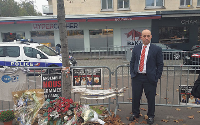 ADL CEO Jonathan Greenblatt at the memorial outside the Hyper Cacher kosher market in Paris, where terrorists murdered four Jewish patrons, and held 15 others hostage in a Jan. 9, 2015, attack    Photo courtesy Anti-Defamation League