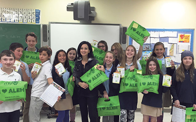 The sixth-graders of Solomon Schechter Day School and “Morah Mati” send their message.