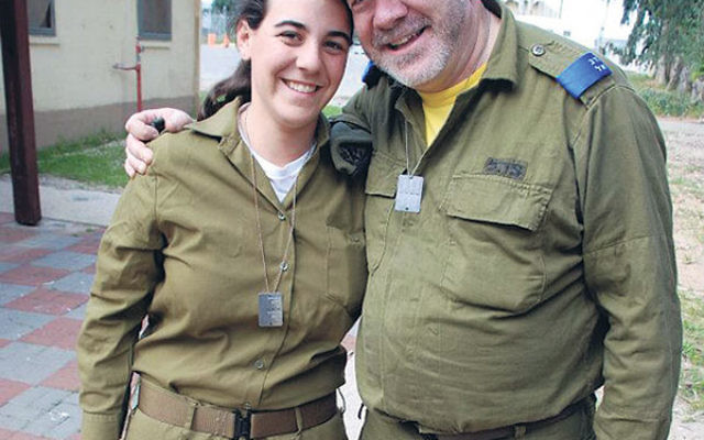 Anat Litwok with her father, Steve, on an army base in Israel in March 2012, when he was serving in Sar-El: National Project for Volunteers for Israel.