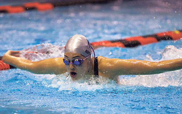 Antiles swimming butterfly at a Columbia University meet.