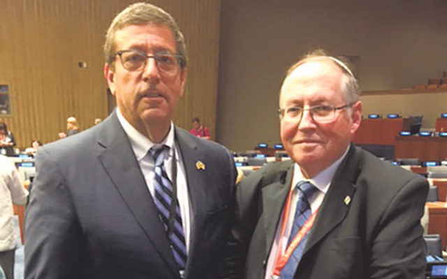 Mark Levenson, president of NJ State Association of Jewish Federations, left, with Elyakim Rubinstein, vice president of Israel’s Supreme Court, at the United Nations conference on the anti-Israel Boycott, Divestment, and Sanctions movement.  &