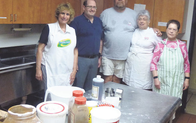 The Temple Beth El of Somerset baking team includes, from left, Dianne Foss, Rabbi Eli Garfinkel, Ira and Sheri Messer, and Janet Goldstein.     
