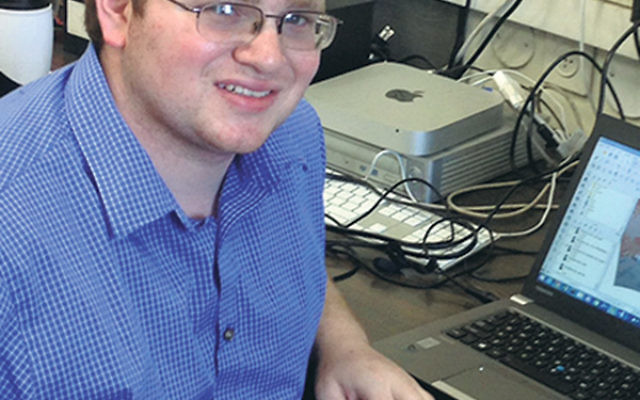 Jonathan Falk at work on his computer studying temperature patterns during his summer internship at Bar-Ilan University in Israel.     