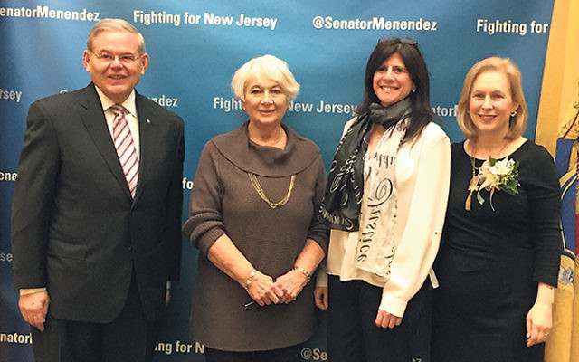 Joining Sen. Robert Menendez in pressing for passage of the International Violence Against Women Act are, from left, Merle Kalishman, former chair of the Community Relations Committee of Greater MetroWest NJ; CRC director Melanie Roth Gorelick; and Sen. K