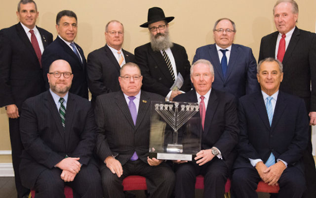 Honorees and dignitaries attending the dinner, seated from left, Attorney General Christopher Porrino; Port Authority Police superintendent Michael Fedorko; Dennis Kelly, and Chabad board chair Danny Kahane. Standing from left, Lt. General Michael Linning