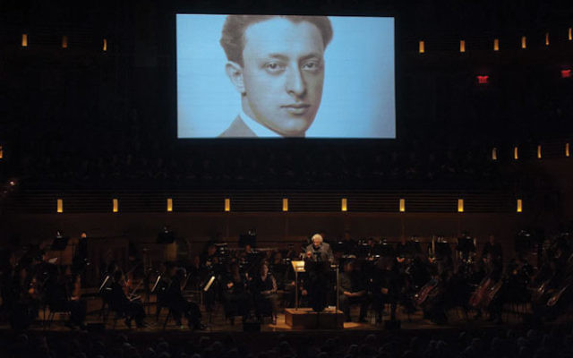 Murry Sidlin talks to his audience at the Music Center at Strathmore in Maryland about Rafael Schachter, who organized the choir of prisoners at Theresienstadt who sang Verdi’s Requiem. 