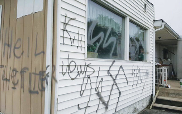 Anti-Semitic and white supremacist graffiti spray-painted on the Airport Diner in Wantage. Photos by Greg Mazuy