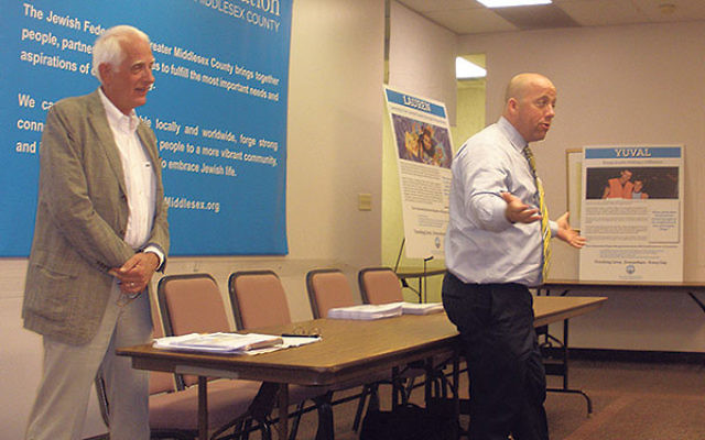 Jewish Federation of Monmouth County executive director Keith Krivitzky told those gathered July 22 at Jewish Federation of Greater Middlesex County offices that the expected merger will help with efforts to attract the next generation to federation. Look