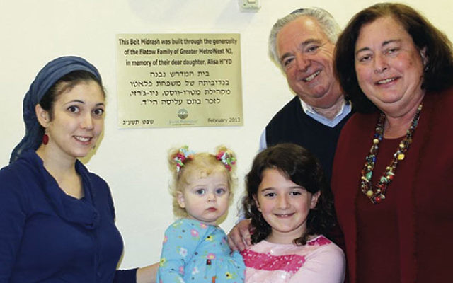 Roz and Stephen Flatow, right, their daughter-in-law Shaina, and granddaughters Maayan Alisa, left, and Michal, at the dedication of the beit midrash, study center, created in the name of their daughter Alisa at MetroWest High School in Ra’