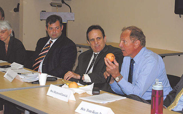 Sen. Raymond Lesniak, second from right, points out that quality fruit is beyond the SNAP recipients’ budget. With him on a Food Stamp Challenge discussion panel are, from left, Assembly member John McKeon, Diane Riley, CRC government affairs cochai